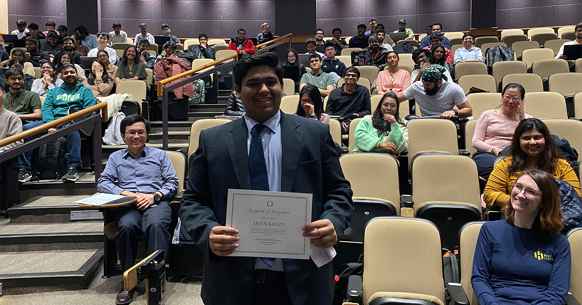 Arjun Rao Kaveti proudly displays his Terp-IS Award certificate.