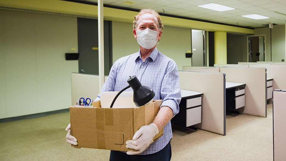 Person holding box of office supplies